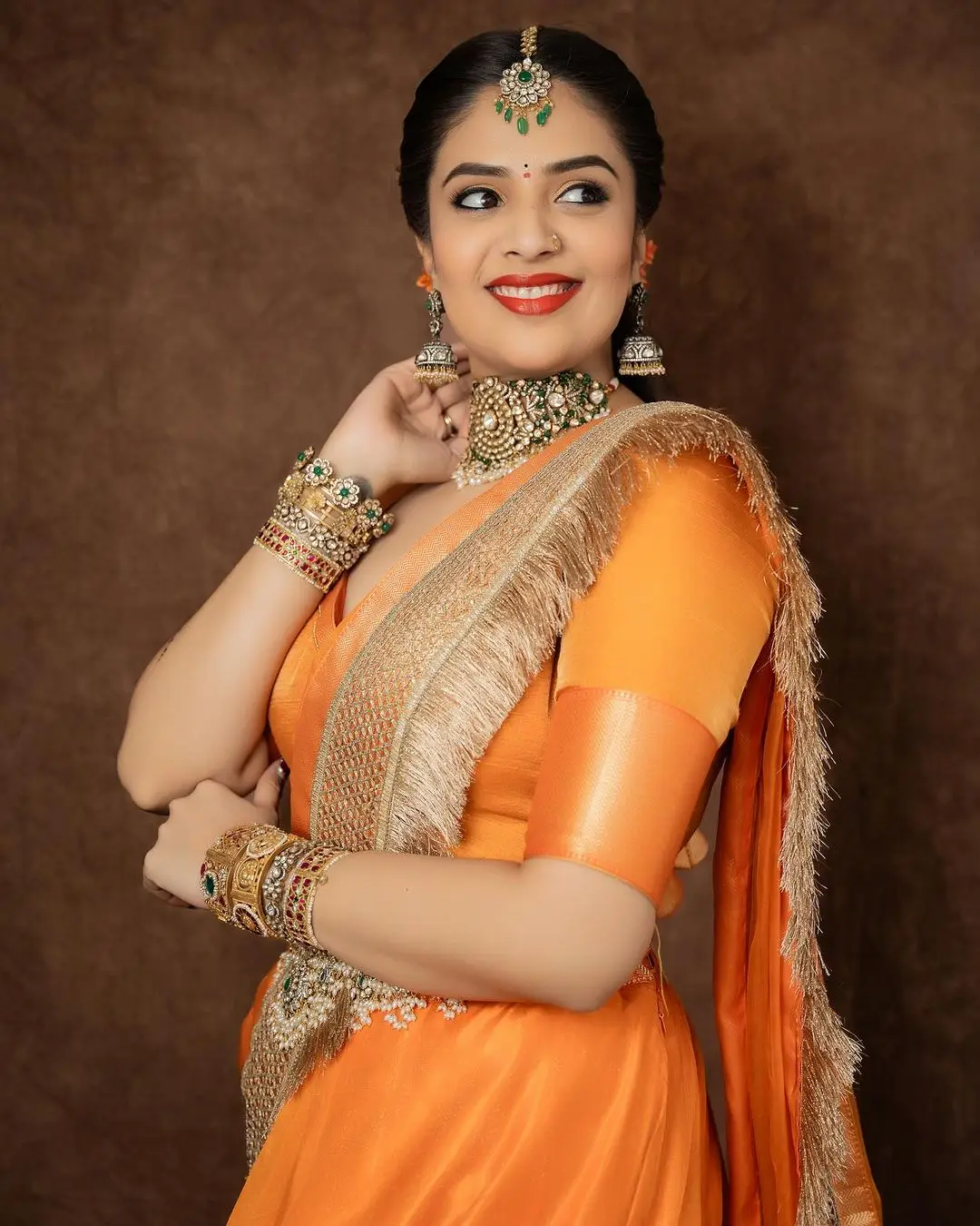 ETV Actress Sreemukhi in Orange Lehenga Blue Choli